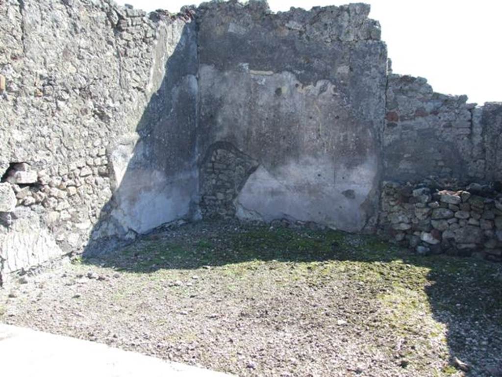 VII.15.2 Pompeii. March 2009. Looking south across dining room on east side of tablinum.
According to PPM –
The zoccolo would have been black and was subdivided into panels which were crossed horizontally by “carpet borders” separated by compartments with painted plants. The middle area of the walls would have been yellow with panels with “carpet borders” separated by narrow architectural ends.
See Carratelli, G. P., 1990-2003. Pompei: Pitture e Mosaici: Vol. VII. Roma: Istituto della enciclopedia italiana, p. 739 no. 69.