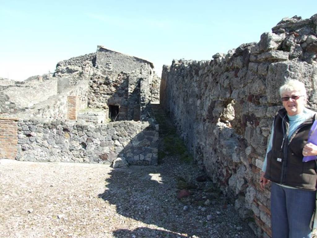 VII.15.2 Pompeii. March 2009. Looking east to corridor leading to kitchen and baths area.