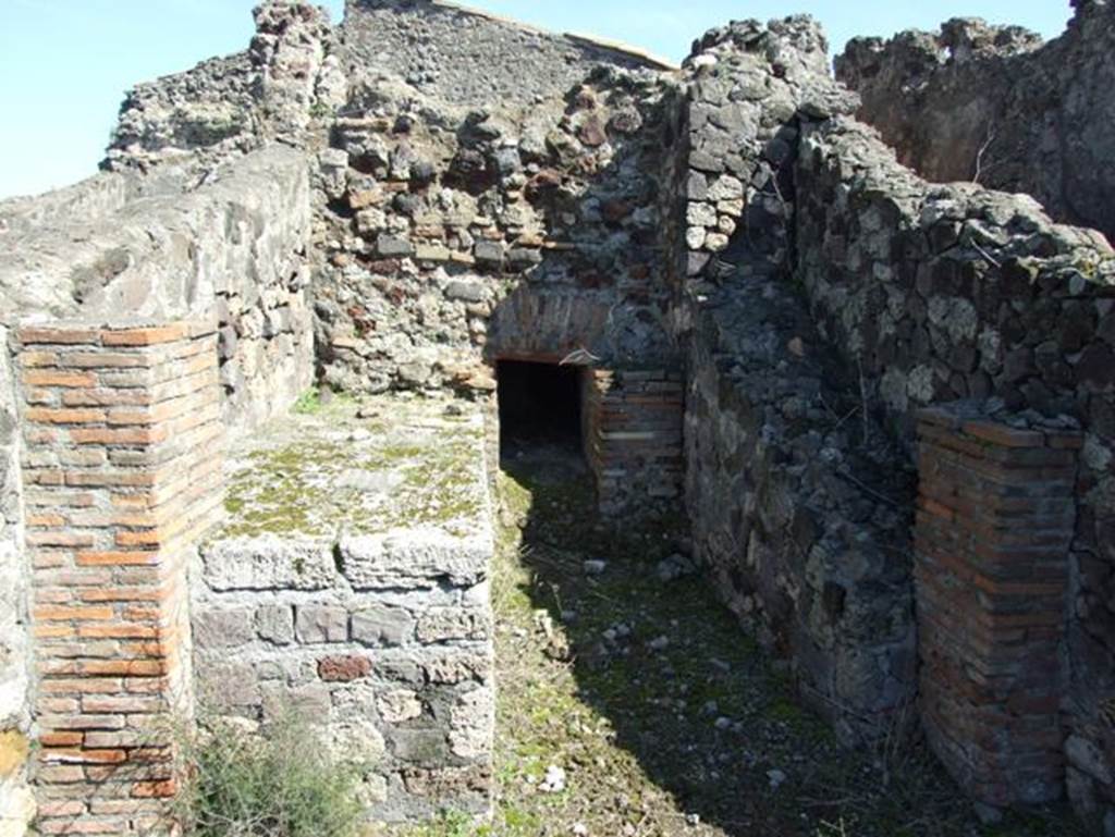 VII.15.2 Pompeii.  March 2009. Kitchen.  Hearth, oven and remains of stairs on right to upper floor.