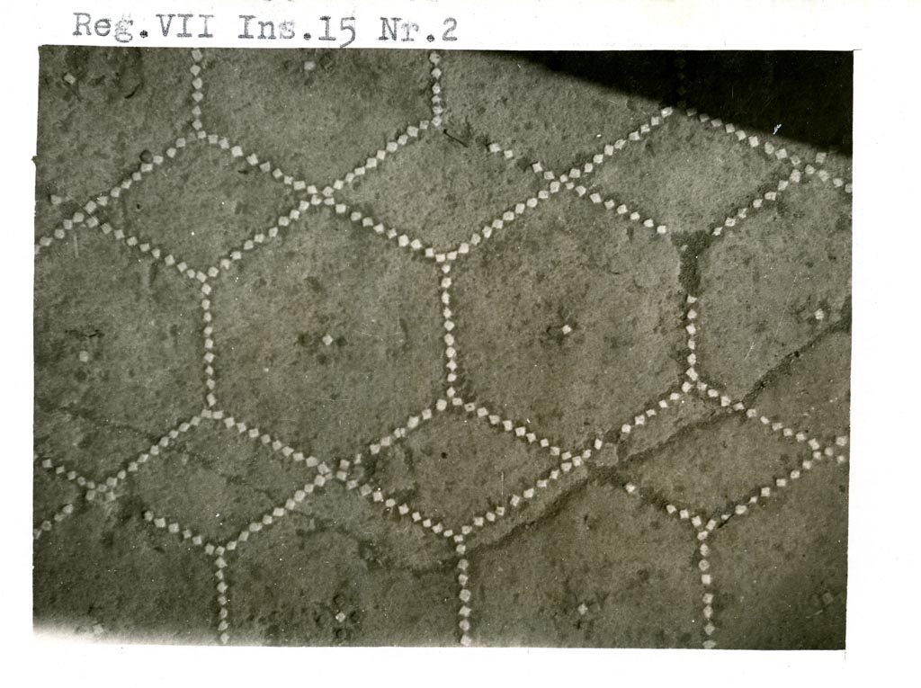 VI.15.2 Pompeii. Pre-1937-39.
Flooring in apodyterium, or exedra/lounging room, made of cocciopesto with a net of hexagons and diamonds and a cross with four small black tiles and a central small white tile. Around the edge of the floor was a single line of small white tiles.
Photo courtesy of American Academy in Rome, Photographic Archive. Warsher collection no. 1309.