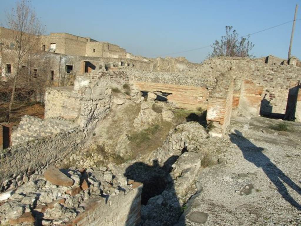 VII.16.15 Pompeii. December 2007. Looking north-east from north side of room 2, atrium. Looking across site of rooms 7, 6, 5, and rooms 15 and 16 on lower level of VII.16.16.