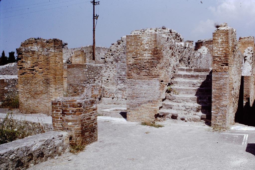 VIII.2.16 Pompeii. 1968.
Looking north towards triclinium, originally with a floor of cocciopesto in the centre of which was a shallow basin/tub with a border of moulded marble.
Found at the base of this was the emblema with the fishes, now in Naples Museum. Photo by Stanley A. Jashemski.
Source: The Wilhelmina and Stanley A. Jashemski archive in the University of Maryland Library, Special Collections (See collection page) and made available under the Creative Commons Attribution-Non-Commercial License v.4. See Licence and use details.
J68f1230
