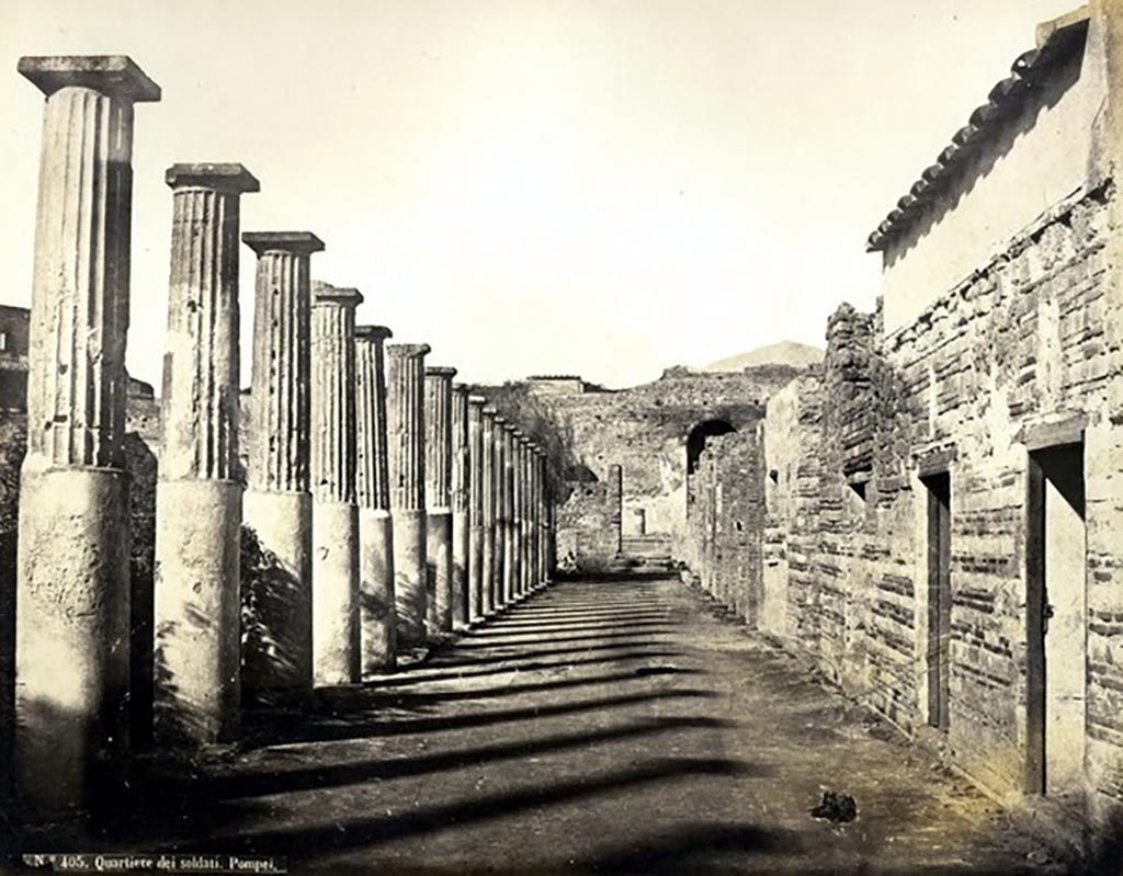 VIII.7.16 Pompeii. Looking north along east portico, described as Quartiere dei soldati - Pompei.
Photograph No. 405, by Roberto Rive, (18..-1889). Public domain, via Wikimedia Commons