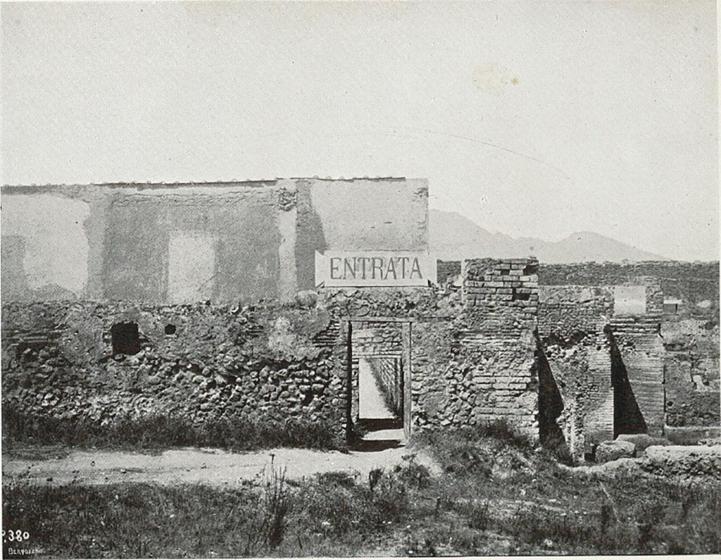VIII.7.16 Pompeii. c.1907-1908. Photograph titled “Attuale entrata dal ludo gladiatorio”.
Looking north towards entrance doorway into small room at exterior south-east corner of Gladiator’s Barracks.
This would have been an original entry to excavations of Pompeii.
According to Sogliano –
“………..and the very petty and inconvenient entry into Pompeii, made a few years ago, from a narrow corner of the Ludo Gladiatorium. I will take care of this last filthy situation immediately, transferring the entrance to the Porta di Stabia, in the same way as one accesses the excavations by the Porta Marina and the Porta Nola.”
See Sogliano, A. (1908). Dei lavori eseguiti in Pompei dal 1 Aprile 1907 a tutto Giugno 1908. (p. 16 and fig.7).