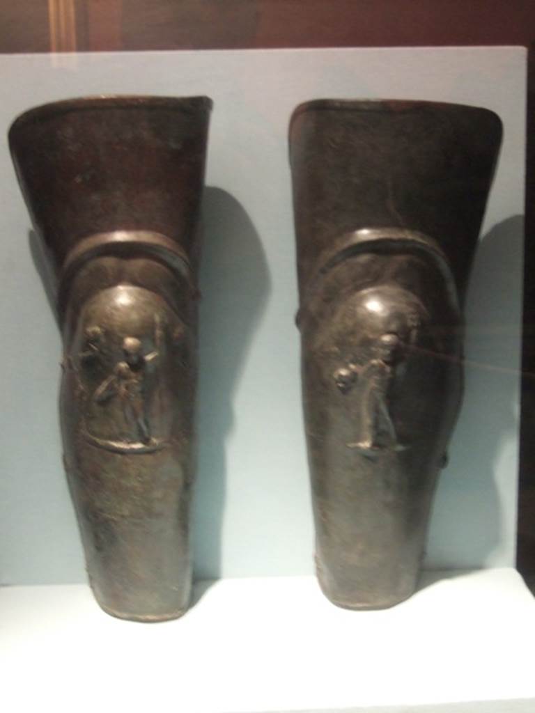 VIII.7.16 Pompeii. December 2007. Pair of bronze leggings or Gladiator’s Greaves, found in the barracks.