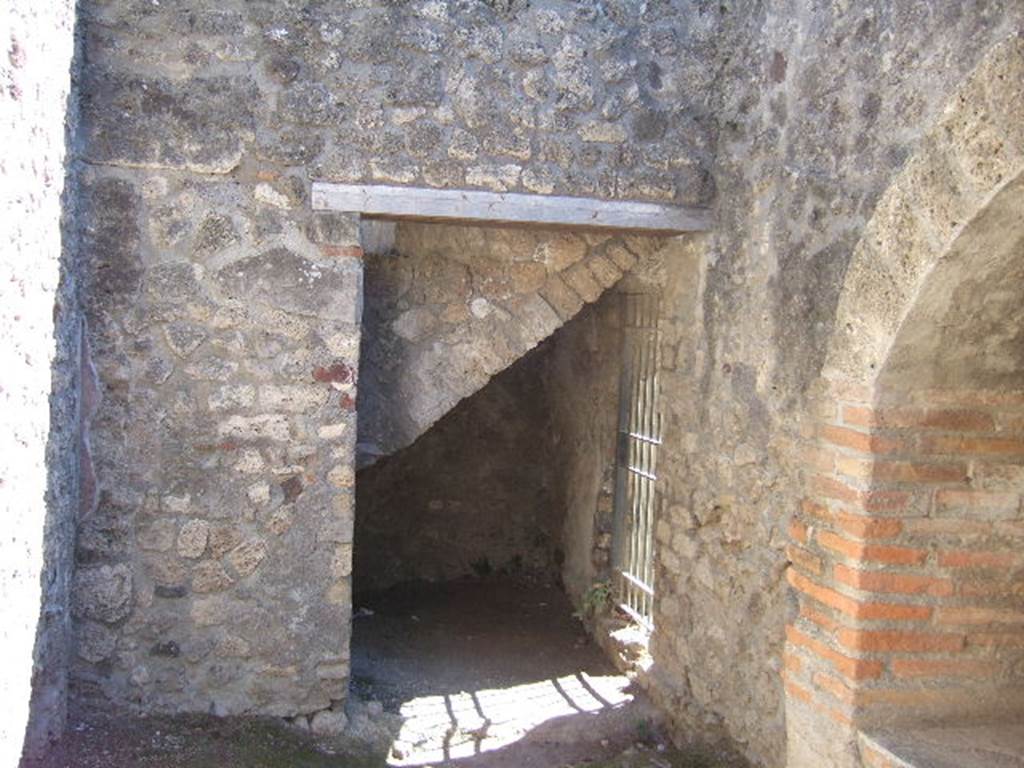 VIII.7.28 Pompeii. December 2007. Kitchen area. Looking south into small room at rear. This room is under the steps leading to the upper part of the Large Theatre.