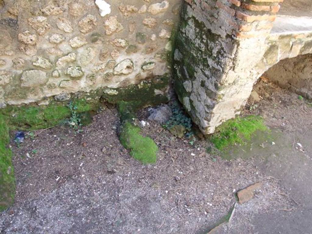 VIII.7.28 Pompeii.  March 2009. Remains of structure against west wall in Kitchen.