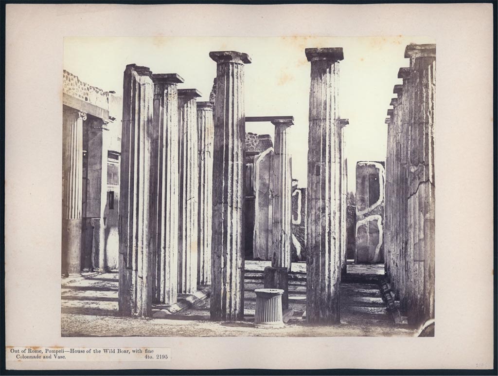 IX.1.20 Pompeii. 1869-1877. Looking south across atrium from tablinum 10.
This shows the puteal for the cistern, the pillar for a fountain, and a circular fountain disc central in the impluvium.
Photo courtesy of British School at Rome, John Henry Parker Collection, inv. no 2195.
https://digitalcollections.bsr.ac.uk/islandora/object/PARKER:735