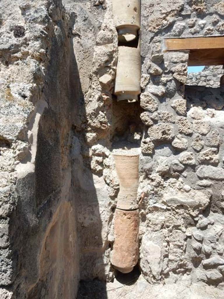 IX.2.27/27 Pompeii. May 2017. Downpipe from upper floor in latrine. Photo courtesy of Buzz Ferebee.