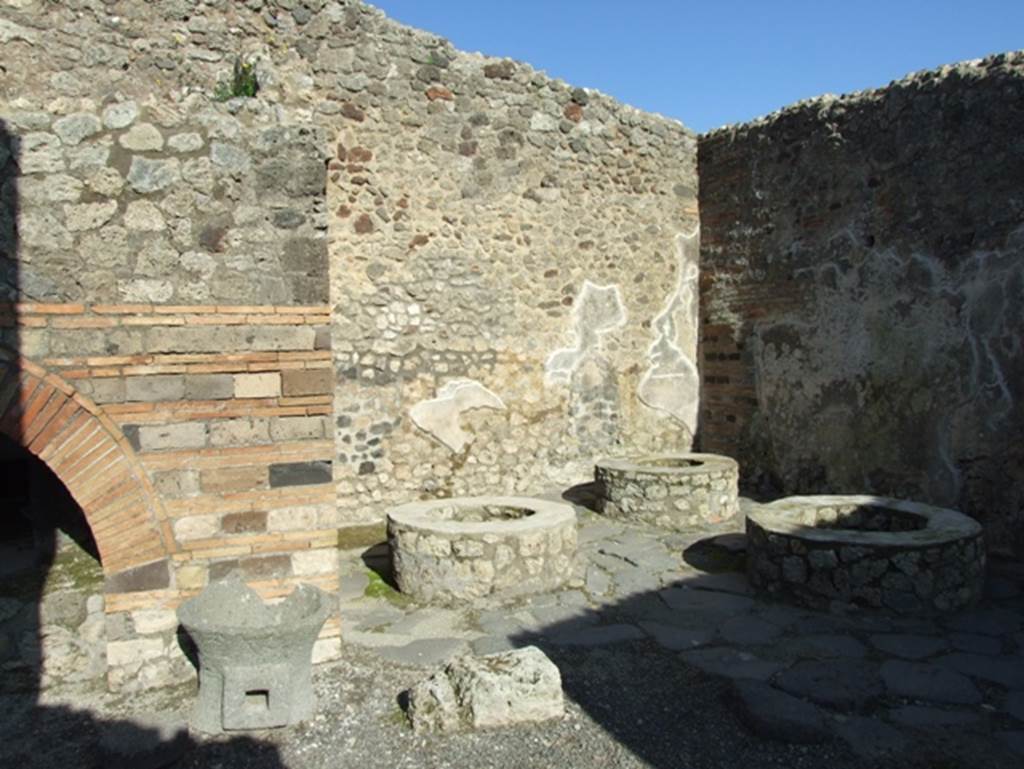IX.3.12 Pompeii. March 2009. Mills on south side of oven.