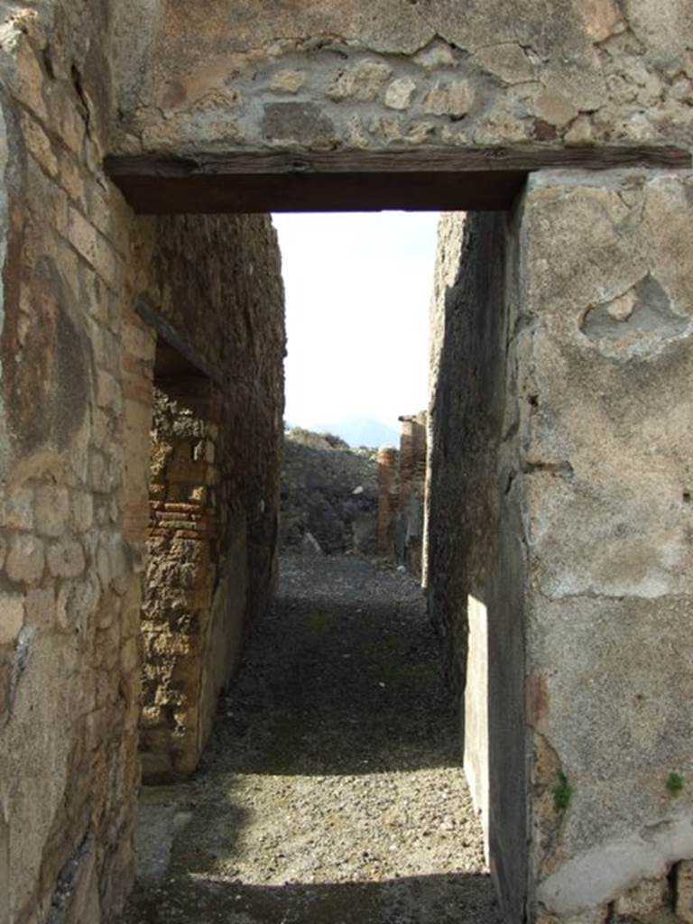 IX.3.15 Pompeii. March 2009. Room 7, corridor, looking north to west portico.
