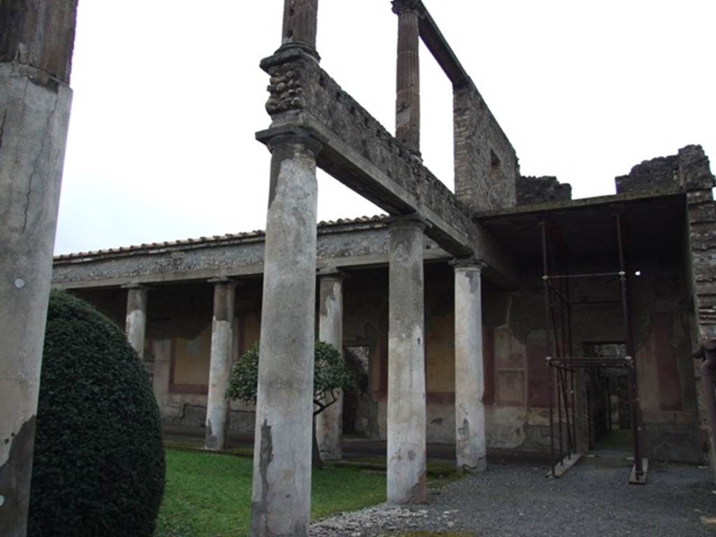 IX.8.6 Pompeii. March 2009.   North west corner of Portico.  Looking west.