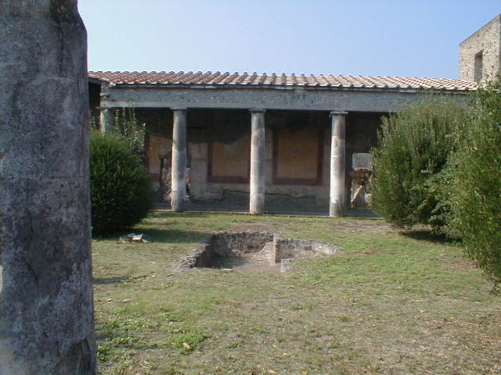 IX.8.6 Pompeii. September 2004. Peristyle, looking west across pool.
According to Garcia y Garcia, in 1943 a bomb destroyed the central pool of the peristyle, and fortunately did not damage other parts.
See Garcia y Garcia, L., 2006. Danni di guerra a Pompei. Rome: L’Erma di Bretschneider. (p.158)

