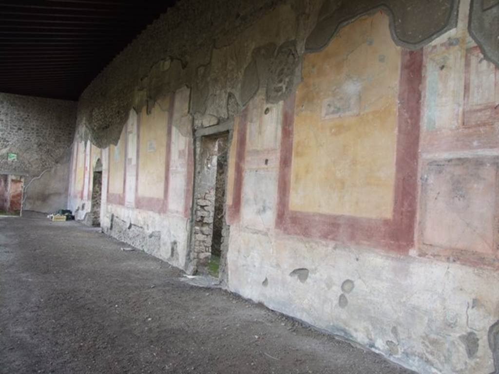 IX.8.6 Pompeii. December 2007. West portico, looking south. Schefold describes six large panels separated by seven views which are framed. These framed views are of wind gods shown with winged heads. They are listed as (from south to north) Boreas, Oceanus, Zephyr, then two gaps, Apeliotes, Euros or Notos, See Schefold, K., 1957. Die Wnde Pompejis. Berlin: De Gruyter.  (p. 276).