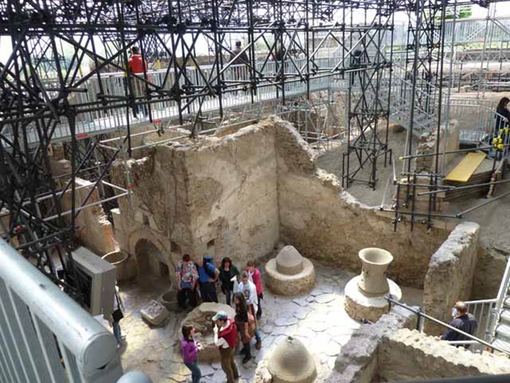 IX.12.6 Pompeii. May 2010. Room “f”, the bakery, looking south-west from above. The stairs descend into room “g”.