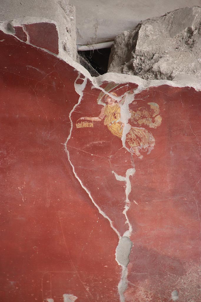 IX.12.6 Pompeii. October 2024.
Room “m”, detail of flying figures from east wall, on south side of central painting.
Photo courtesy of Klaus Heese.