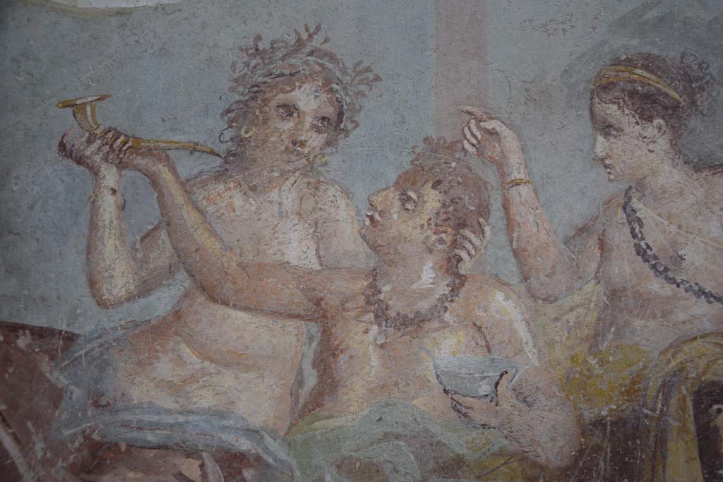IX.12.6 Pompeii. February 2017. Room “m”, detail of figures in banqueting scene on east wall. Photo courtesy of Johannes Eber.