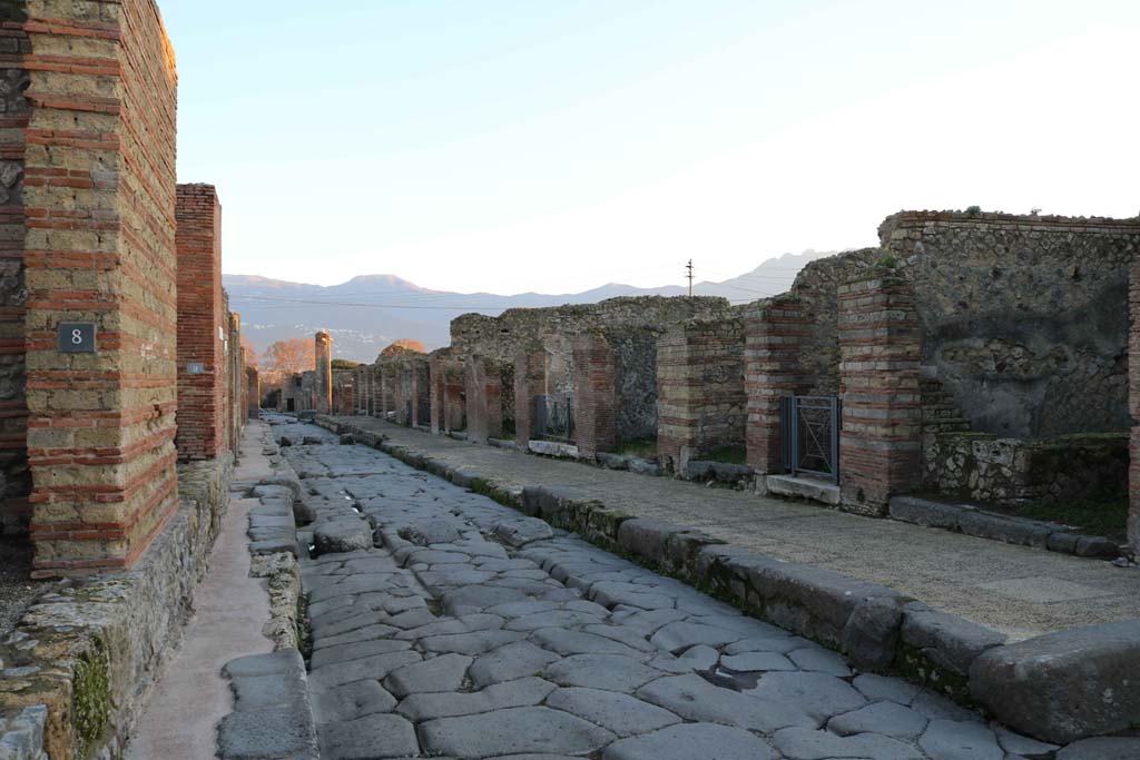 Via Stabiana, Pompeii. December 2018.
Looking south between IX.4.8, on left, and VII.2.15, on right, on corner of Vicolo del Panettiere. Photo courtesy of Aude Durand.