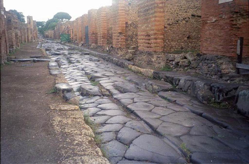 Via Stabiana, July 2011.
Looking north towards Vicolo del Panettiere, on left, and IX.4, on right, from near junction with unnamed vicolo between IX.4 and IX.3.
Photo courtesy of Rick Bauer.