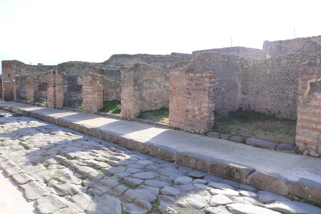 Via Stabiana, west side, Pompeii. December 2018.
Looking south from VII.3.18, on right, towards VII.3.23, on left. Photo courtesy of Aude Durand.
