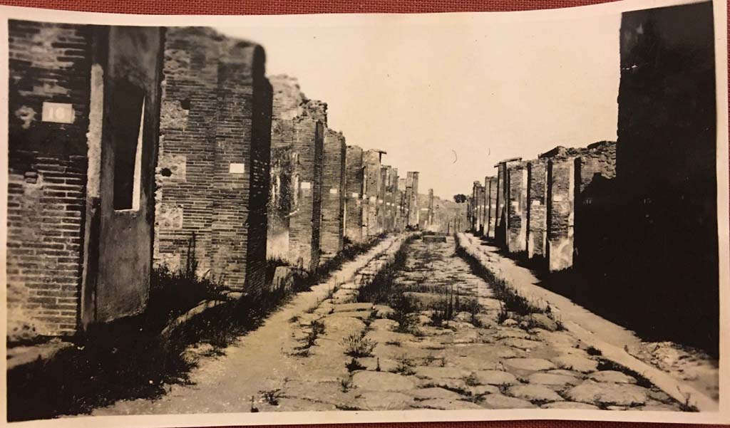 Via degli Augustali, Pompeii. Photo from an album, dated 1928. Looking east from near VII.4.16, on left.
Photo courtesy of Rick Bauer.
