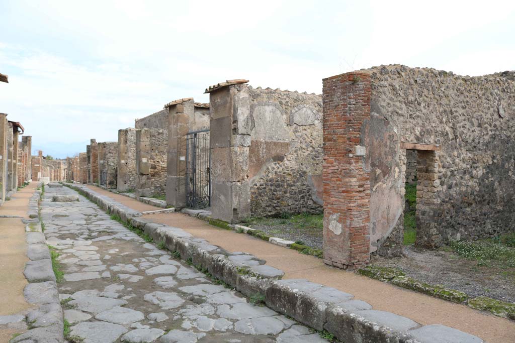 Via degli Augustali, south side, Pompeii. December 2018. 
Looking east from VII.9.17, linked to VII.9.18, on right. Photo courtesy of Aude Durand.
