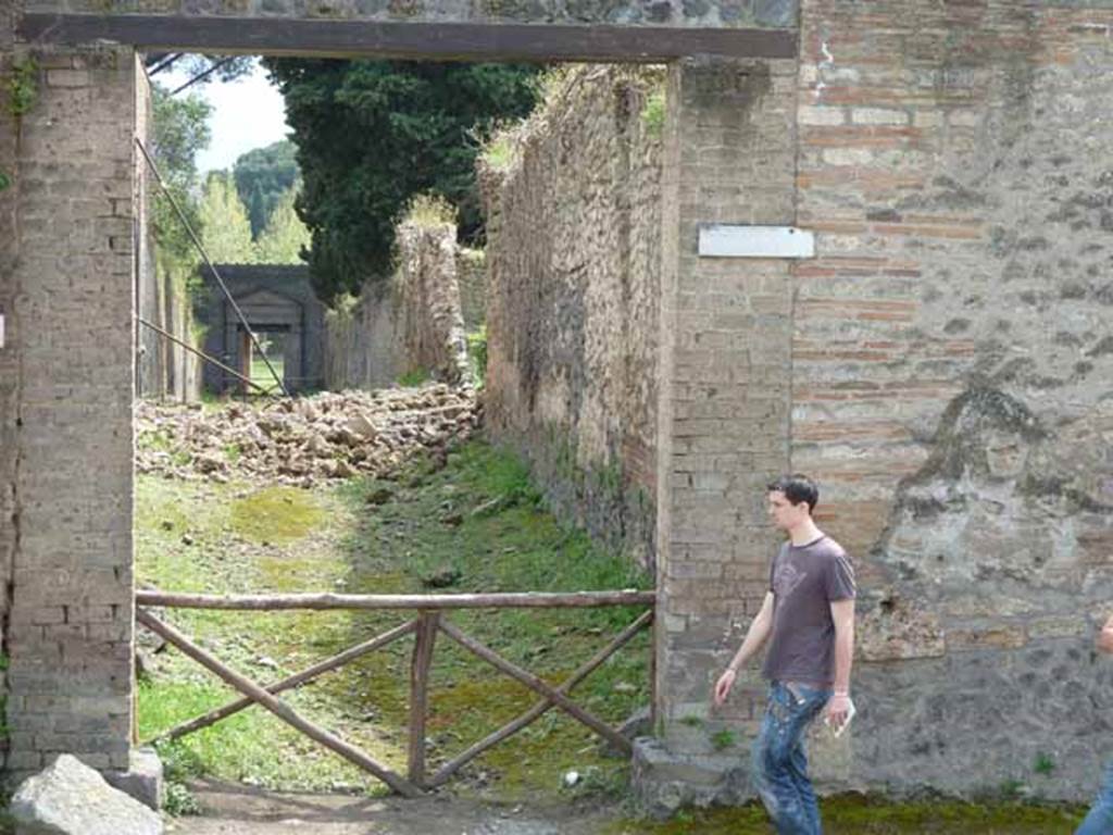 Via dell’Abbondanza, south side. May 2010. Vicolo della Venere between III.3 and II.2.