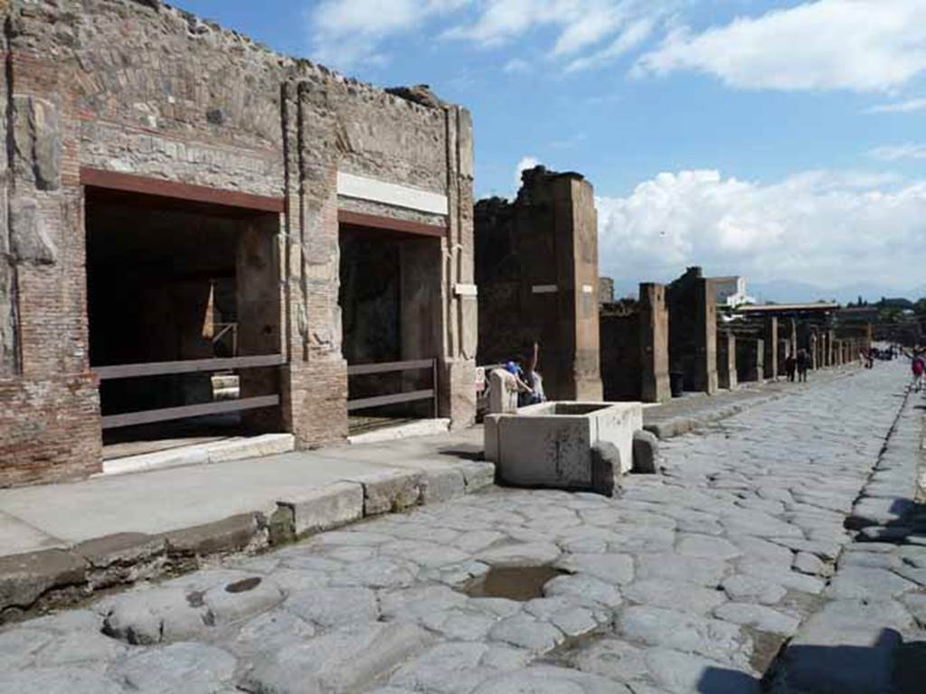 Via dell’Abbondanza, north side. May 2010. Looking east to VII.9.68/67, junction to Vicolo di Eumachia, and insula VII.13.