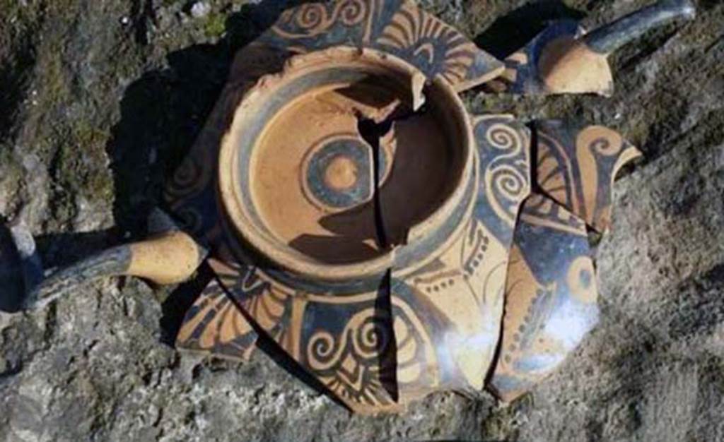 Santuario extraurbano del Fondo Iozzino. 2014. Decorated pottery with two horn style handles.
According to the PAP website, the most striking aspect of the finds dated to the Archaic Age is the sheer quantity of bucchero pottery with engraved inscriptions in the Etruscan language, which represents the largest corpus of Etruscan inscriptions yet found in a single context in Southern Italy. The bucchero pottery was employed in sacrifices which saw offerings of red or white wine, or herbal infusions, to the gods.
The inscriptions were made on the basin and on the feet of the bowls and banquet vases, which after usage were deposited upside down on the ground.
These inscriptions reveal the names of those who made the offerings - Etruscans who also came from Tuscany, and of the deities to whom the sanctuary was dedicated - the god ‘apa’ or ‘father’ - perhaps Jupiter Meilichios.
L’aspetto più eclatante dei ritrovamenti riferibili all’età arcaica è costituito dalla notevole quantità di vasellame in bucchero con iscrizioni graffite in lingua etrusca che rappresenta il più grande corpus di iscrizioni etrusche fino ad ora rinvenuto in un unico contesto in Italia meridionale. Il vasellame in bucchero era utilizzato per sacrifici che prevedevano l’offerta alle divinità di vino rosso e bianco, o infusi d’erbe.
Le iscrizioni erano poste sulla vasca e sul piede di scodelle e di vasi da banchetto che, dopo l’uso, venivano deposti capovolti sul suolo.
Queste iscrizioni rivelano i nomi degli offerenti, etruschi che provenivano anche dalla Toscana, e della divinità a cui era dedicato il santuario, il dio “apa” “padre”, forse Giove Meilichios.
Photograph © Parco Archeologico di Pompei.