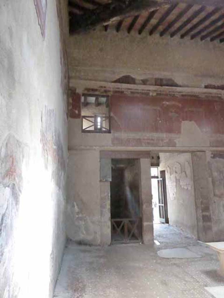 III.11 Herculaneum. May 2010. Room 6, looking east across of atrium towards doorway to room 2, next to entrance fauces or corridor. 
