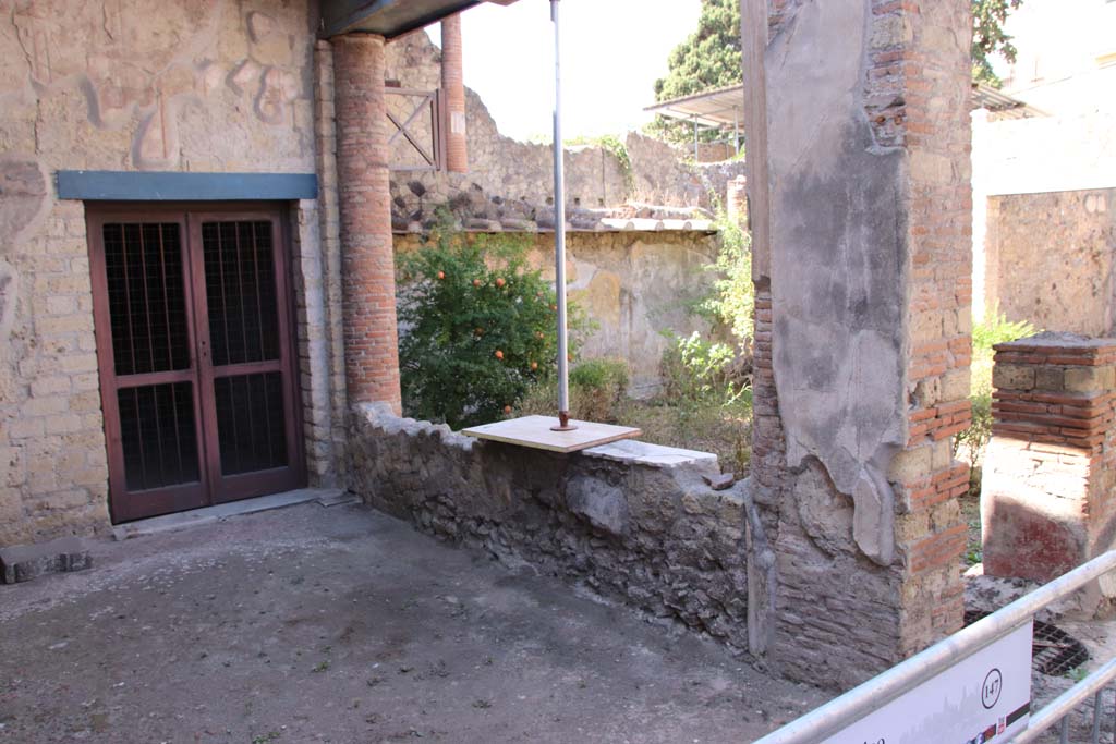 III.11/8 Herculaneum. September 2019. Looking south-west across portico towards doorway from room 8.
Photo courtesy of Klaus Heese.

