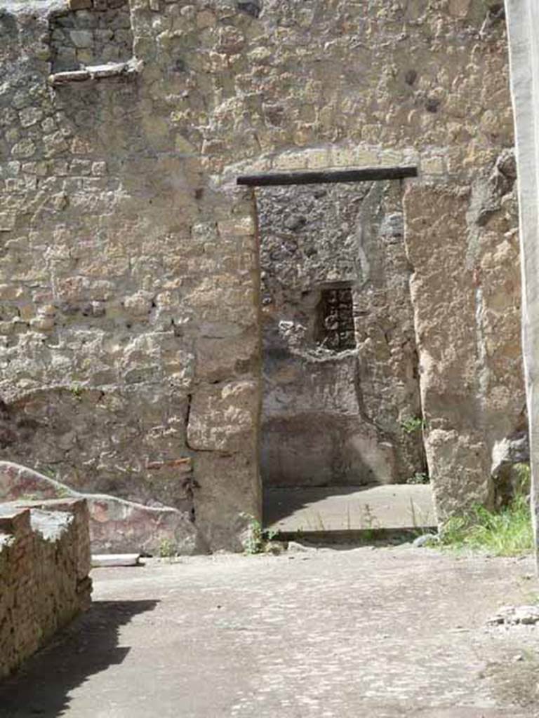 III.11 Herculaneum. May 2010. Doorway to room 17, in north-west corner of peristyle.