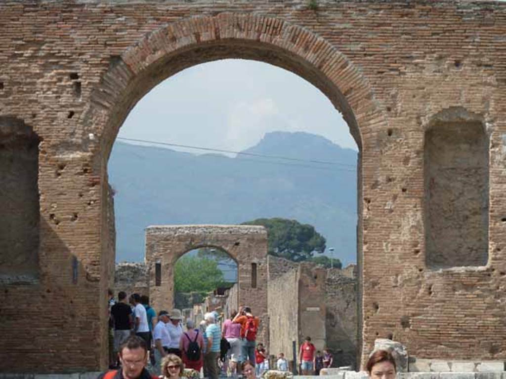 Arch at North East End of the Forum. May 2010. Looking north through arch, along Via del Foro, to the Arch of Caligula.