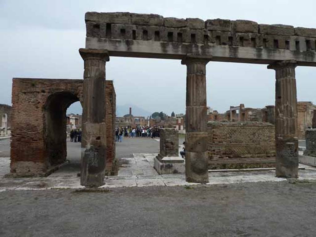 Arched monument at south end of Forum. May 2010. South side, looking north through the colonnade of Popidius.