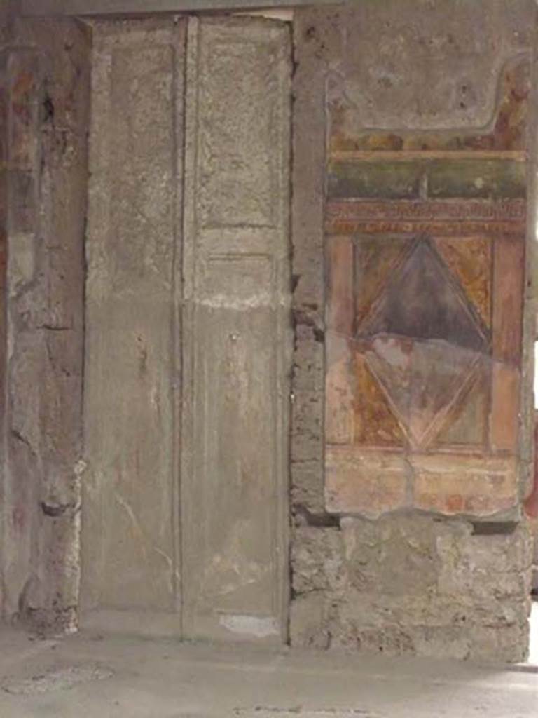 Villa of Mysteries, Pompeii. May 2012. Room 64, cast of doors in north-east corner.
Photo courtesy of Buzz Ferebee.
