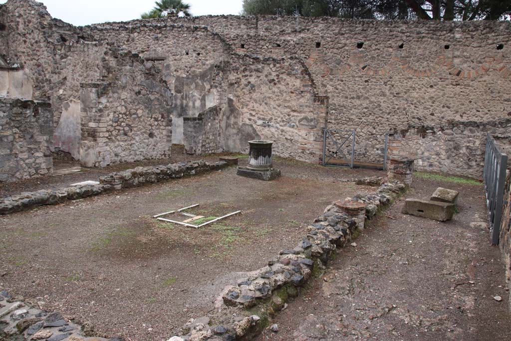 VIII.6.10 Pompeii. October 2020. Looking south-west across peristyle area. Photo courtesy of Klaus Heese.
According to Boyce (who numbers it as VIII.7.9) –
In the peristyle against the wall to the right of the entrance doorway from the street, stands a projecting base (h.1.15, w.1.40, d.0.30).
Traces of original covering with slabs of marble are still to be seen and above it are the remains of a vanished lararium painting.
The top of the pilaster was apparently meant to serve as altar for offerings. 
Nearby was found a small cylindrical altar of tufa (diam.0.28, h.0.32), which Mau supposes was used instead of the top of the pilaster in the last days of the city.
See Bull. Inst. 1884, 183.
See Boyce G. K., 1937. Corpus of the Lararia of Pompeii. Rome: MAAR 14. (p.78, no. 375). 

