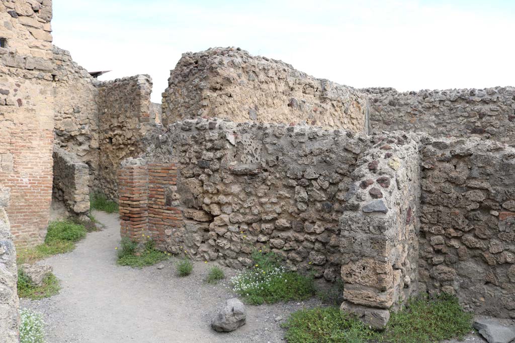 VI.8.8 Pompeii. December 2018. 
Looking north-east towards two small rooms at rear, and east wall with niche. Photo courtesy of Aude Durand.
According to Boyce –38,
In the east wall of one of the rear rooms is a rectangular niche (h.0.38, w.0.40, d.0.14, h. above floor 1.35), its inside walls decorated with red lines and spots on a white ground, its floor projecting like a narrow shelf; Fiorelli called it la nicchia dei Penati.
See Fiorelli, Descrizione, 121.
See Boyce G. K., 1937. Corpus of the Lararia of Pompeii. Rome: MAAR 14, (p.49, no. 169).


