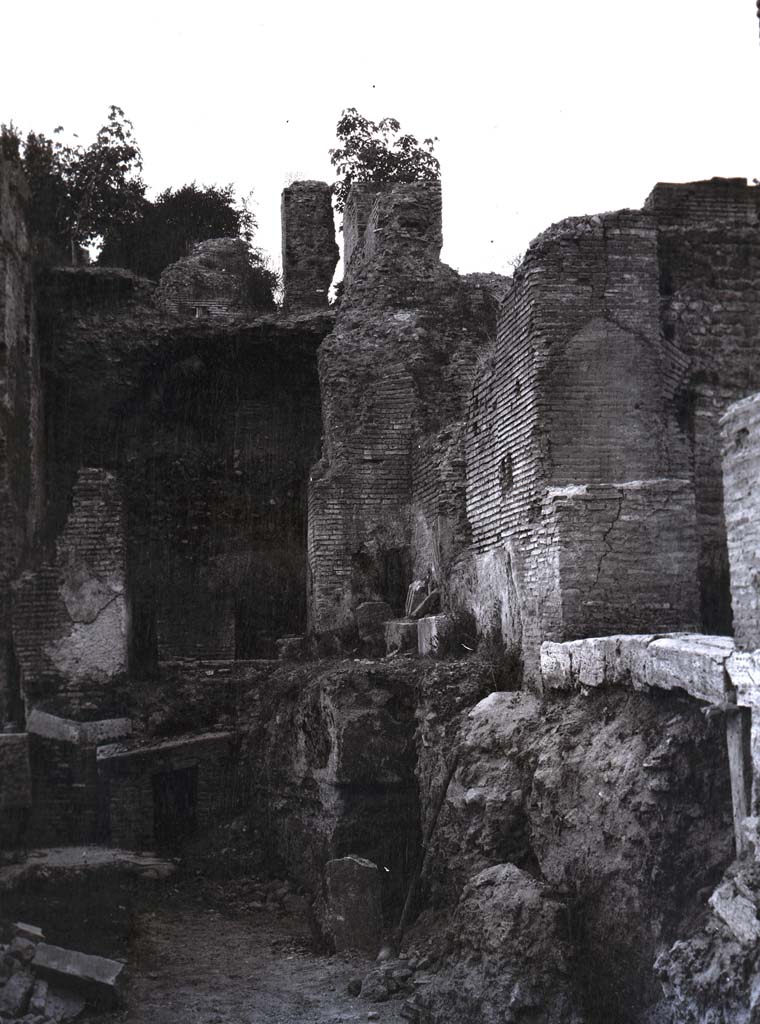 PL.1. Pompeii. Photo by Esther Boise Van Deman (c) American Academy in Rome. VD_Archive_Ph_241.
Description given as Pompeii, Oven, and photo from between 1900-1930.
It does not seem to correspond to any of the ovens in bakeries, the walls look too big to be from a house.
Perhaps the photo is from a Villa, now reburied.
Ostia has been suggested to us, but we wrote to them and they answered that it was not from there.
Can anyone identify this intriguing photograph, as we are at a loss.
