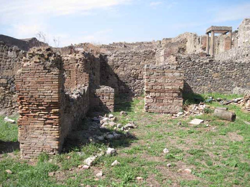 I.1.3 Pompeii. September 2010. Looking north to doorway to room in north-west corner of yard. Photo courtesy of Drew Baker.
