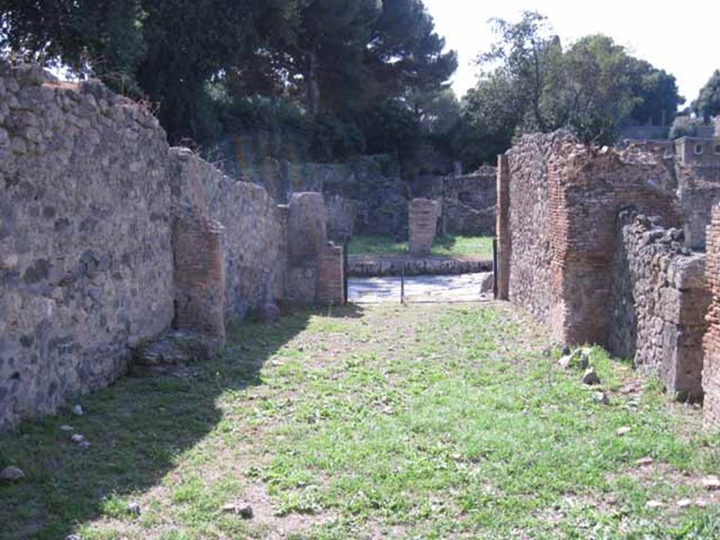 I.1.3 Pompeii. September 2010. Looking west from yard towards entrance room and Via Stabiana. Photo courtesy of Drew Baker.
