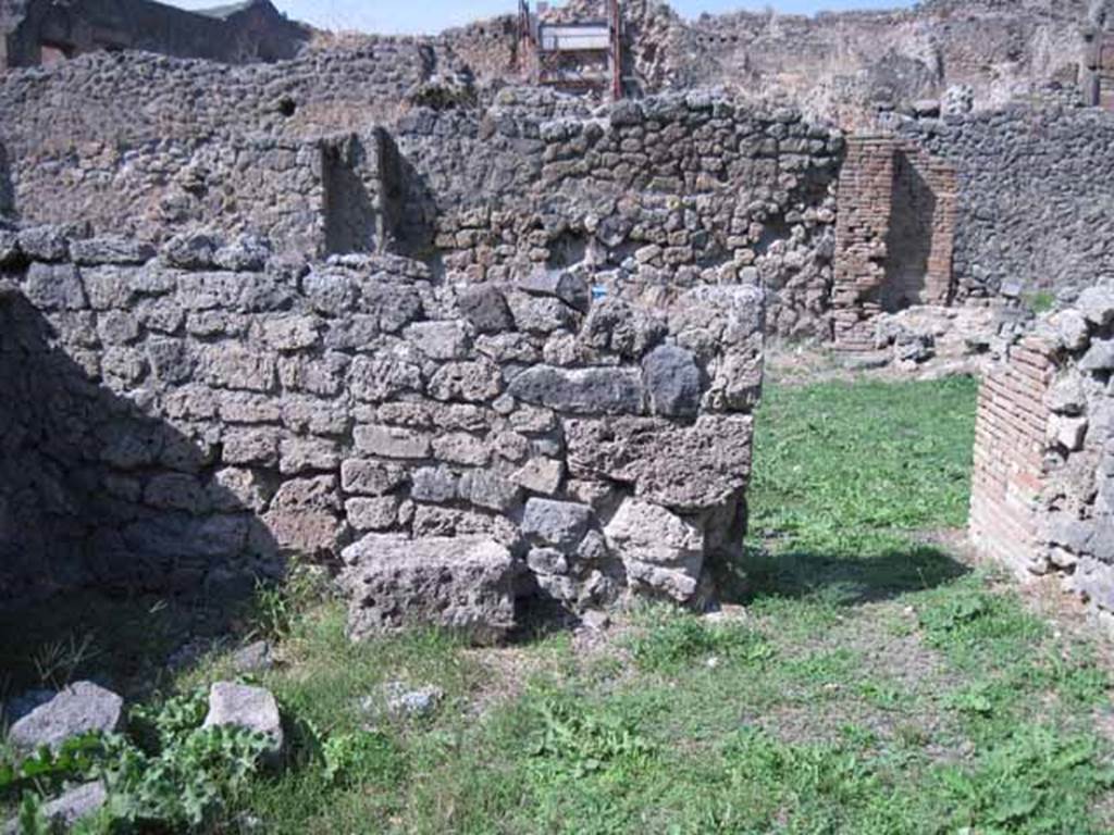 I.1.8 Pompeii. October 2024. Looking south with detail of hearth against south wall of main entrance room. Photo courtesy of Klaus Heese.