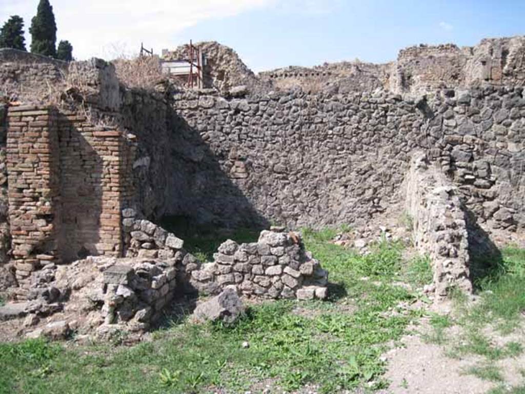 I.1.8 Pompeii. October 2024. Looking south-east towards doorway leading to small room behind I.1.6. Photo courtesy of Klaus Heese.