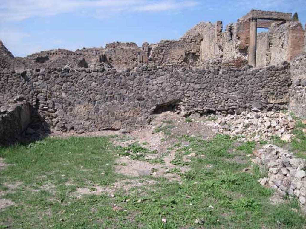 I.1.8 Pompeii. September 2010. North wall of small room, with doorway to large entrance room. Photo courtesy of Drew Baker.
