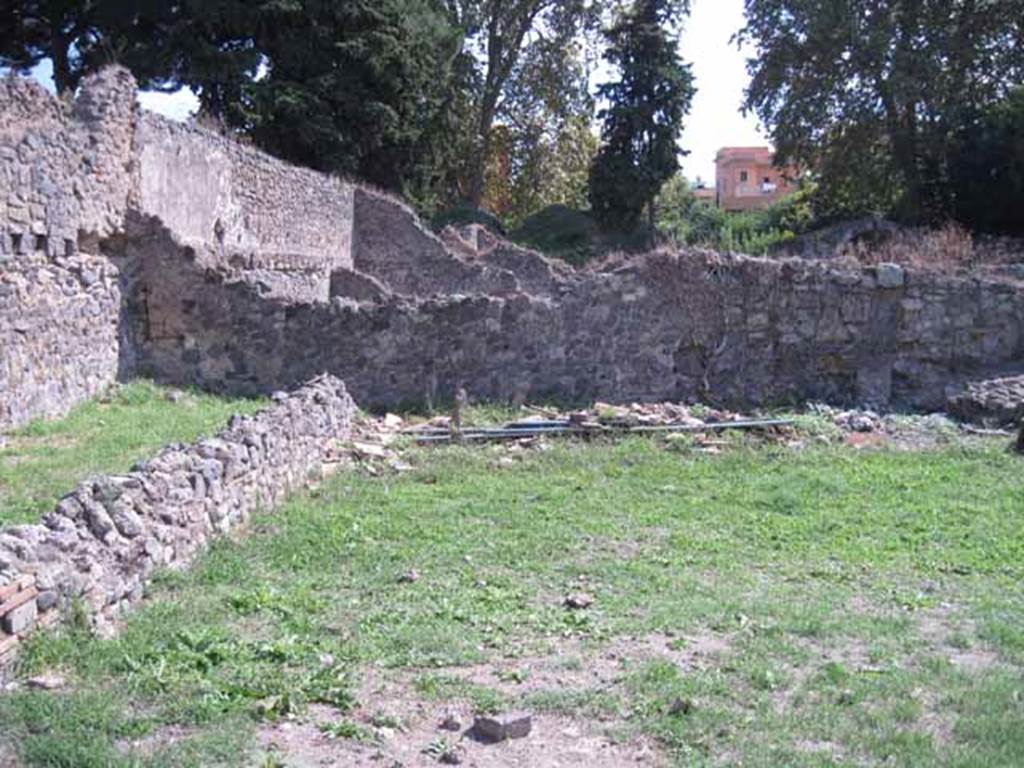 I.1.8 Pompeii. September 2010. North-west corner of dormitory on north side of yard. Looking west.  Photo courtesy of Drew Baker.
