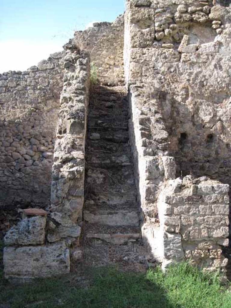 1.2.6 Pompeii. September 2010. Looking north to steps to upper floor, from north portico. Photo courtesy of Drew Baker.
