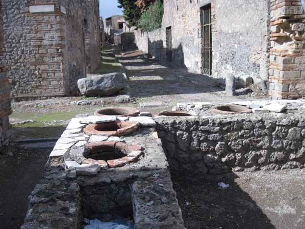 I.2.18 Pompeii. September 2010. Looking north from bar, towards Vicolo del Citarista, between I.3 and I.10. Photo courtesy of Drew Baker.
