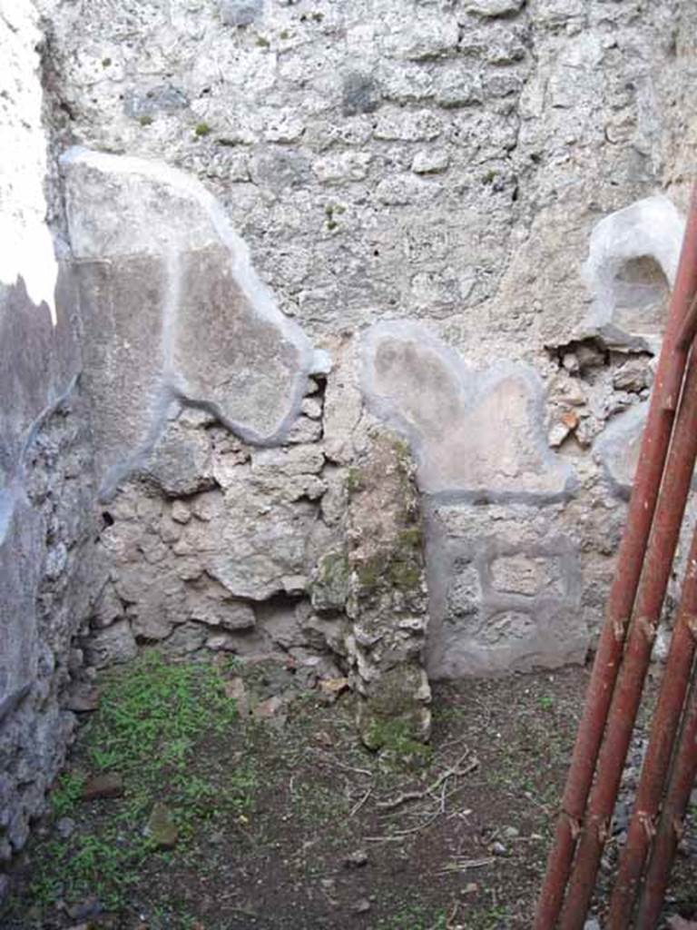 I.2.18 Pompeii. September 2010. Looking south into small room in south-east corner. Latrine and kitchen? 
Photo courtesy of Drew Baker.
According to Fiorelli, the room with the latrine had a hollow in the wall for placing a lamp.  
See Pappalardo, U., 2001. La Descrizione di Pompei per Giuseppe Fiorelli (1875). Napoli: Massa Editore. (p.36)
According to Boyce, in the south-west corner of the kitchen, built in a peculiar manner, was an arched niche.
(height 0.30m, w.0.30m, d.0.25m, height above the floor 1.30m).
See Boyce G. K., 1937. Corpus of the Lararia of Pompeii. Rome: MAAR 14. (p.22, no.12). 
