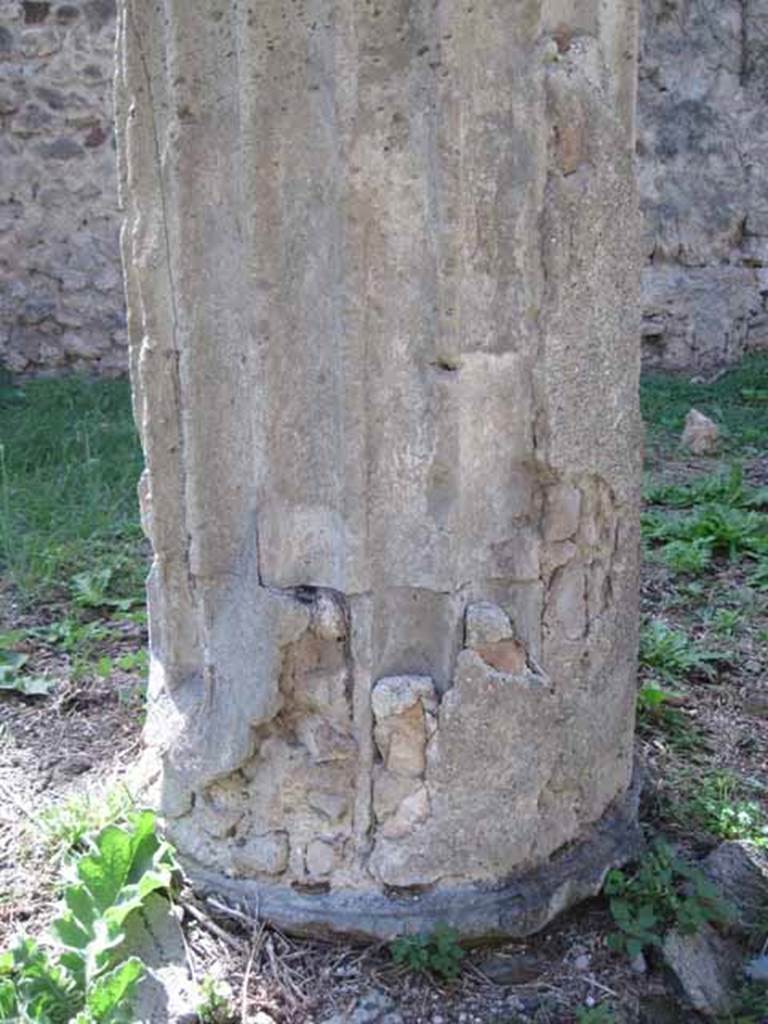 I.2.28 Pompeii. September 2010. Detail of column base of the south west column. (Note original column fluting filled in and plastered over). Photo courtesy of Drew Baker.
