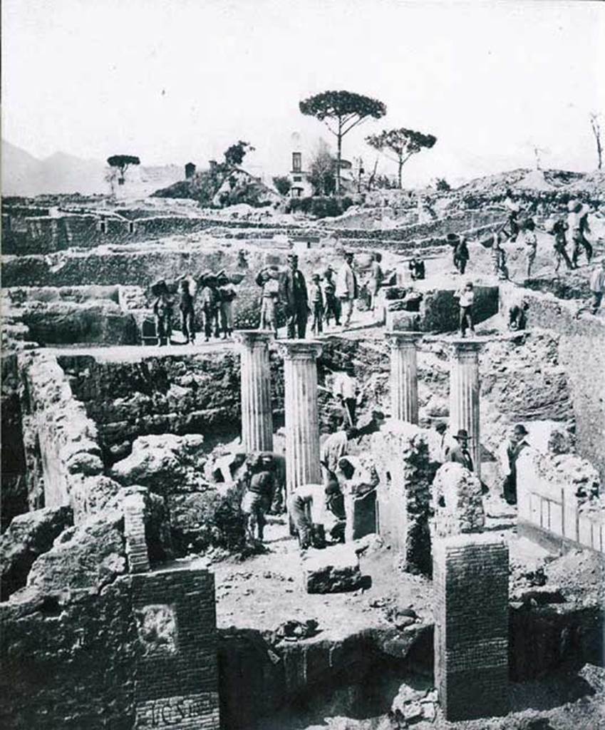 I.2.29-28 Pompeii. May 1873. Detail from photo showing thermopolium and house during excavation. Photo courtesy of Rick Bauer.
According to Della Corte, the bar at I.2.27 was a dependence of the neighbouring house at I.2.28. He could not speculate who they belonged to.
However, he thought it was a certain Polybius, as proved by the recommendation found to the east (right) of the entrance of the bar (the pillar shared with the house at I.2.28):

Polybius rog(at)  [CIL IV 3379]

See Della Corte, M., 1965.  Case ed Abitanti di Pompei. Napoli: Fausto Fiorentino. (p.275)

According to Epigraphik-Datenbank Clauss/Slaby (See www.manfredclauss.de) this read –

Popidium 
/ 
aed(ilem) rog(at) 
Polybius        [CIL IV 3379]
