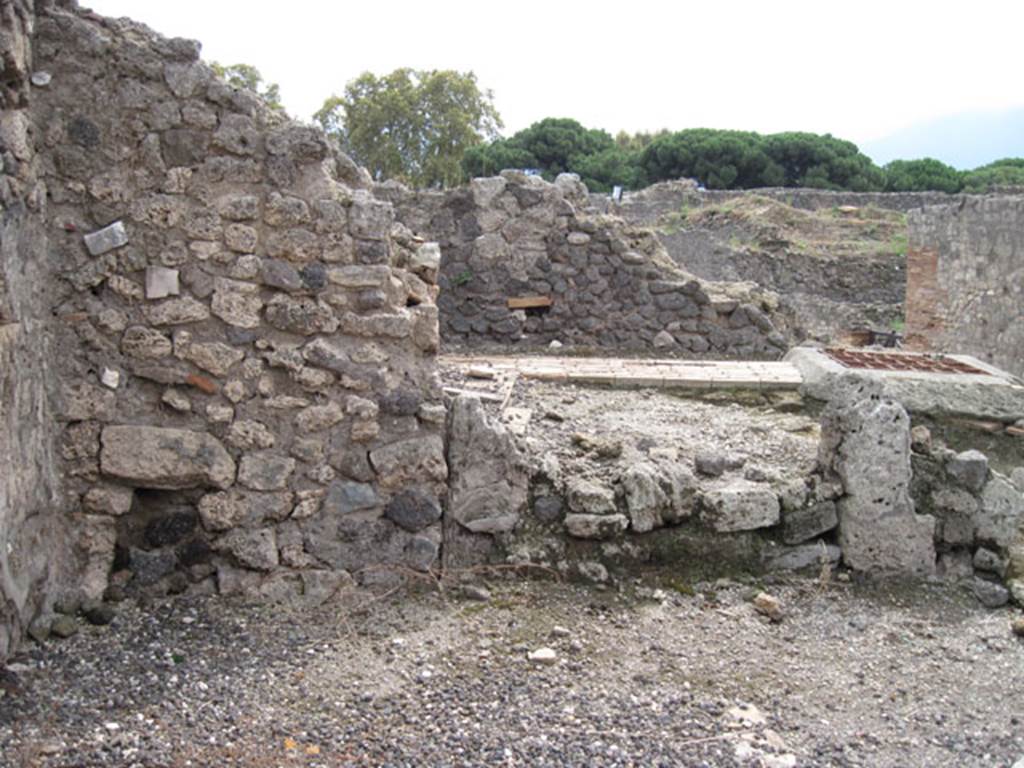 I.3.11 Pompeii. September 2010. Looking towards south wall, note feature in centre of image which resembles blocked up doorway, beyond is the Sarno Canal route. 
Photo courtesy of Drew Baker. The blocked up doorway would have led into the side room, described by Fiorelli as “being for the use of the customers”.

